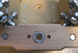 View of the z-axis lead nut in the well shaped hole in the wood.
