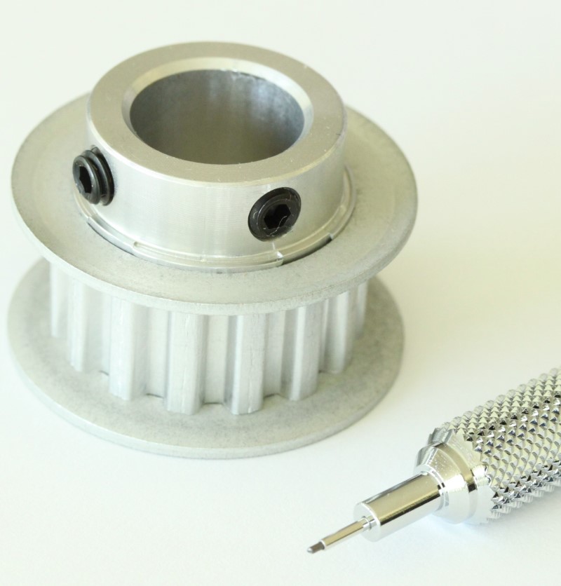 XL 15 teeth drive pulley shown with mechanical pencil for scale