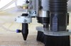 Fabricator Pro CNC Router view of the bottom of the z axis CO2 laser nozzle, spindle and dust shoe.