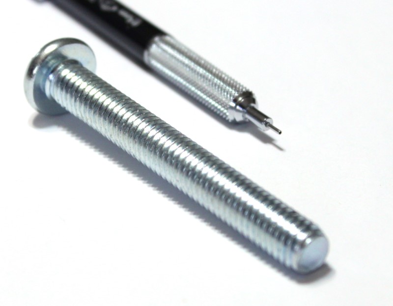 3/8 inch machine screw phillips head drive shown with mechanical pencil for scale