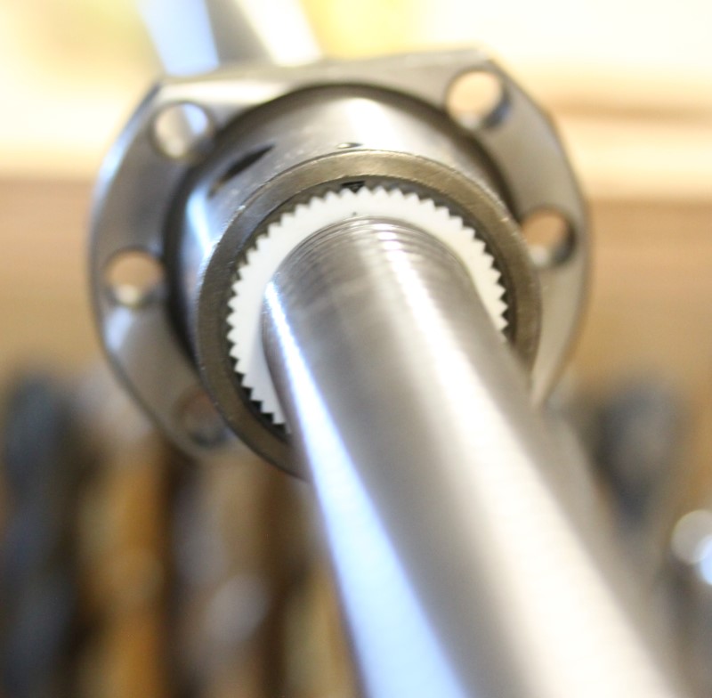 View of the back of the ball nut on the ball screw.
