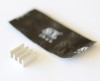 small aluminum heat sink and a packet of thermal compound