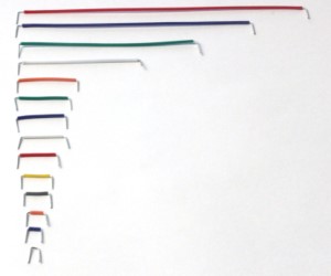 This picture shows 14 different length jumper wires aligned by size from largest (top) to smallest (bottom)