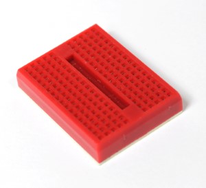A single 17x10 mini breadboard (Red)